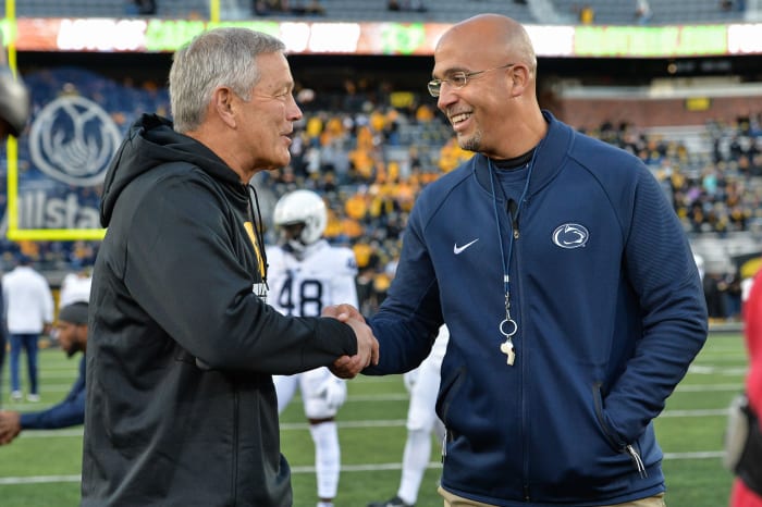 Iowa coach Kirk Ferentz (left) and Penn State coach James Franklin meet before the 2019 Penn State-Iowa game.